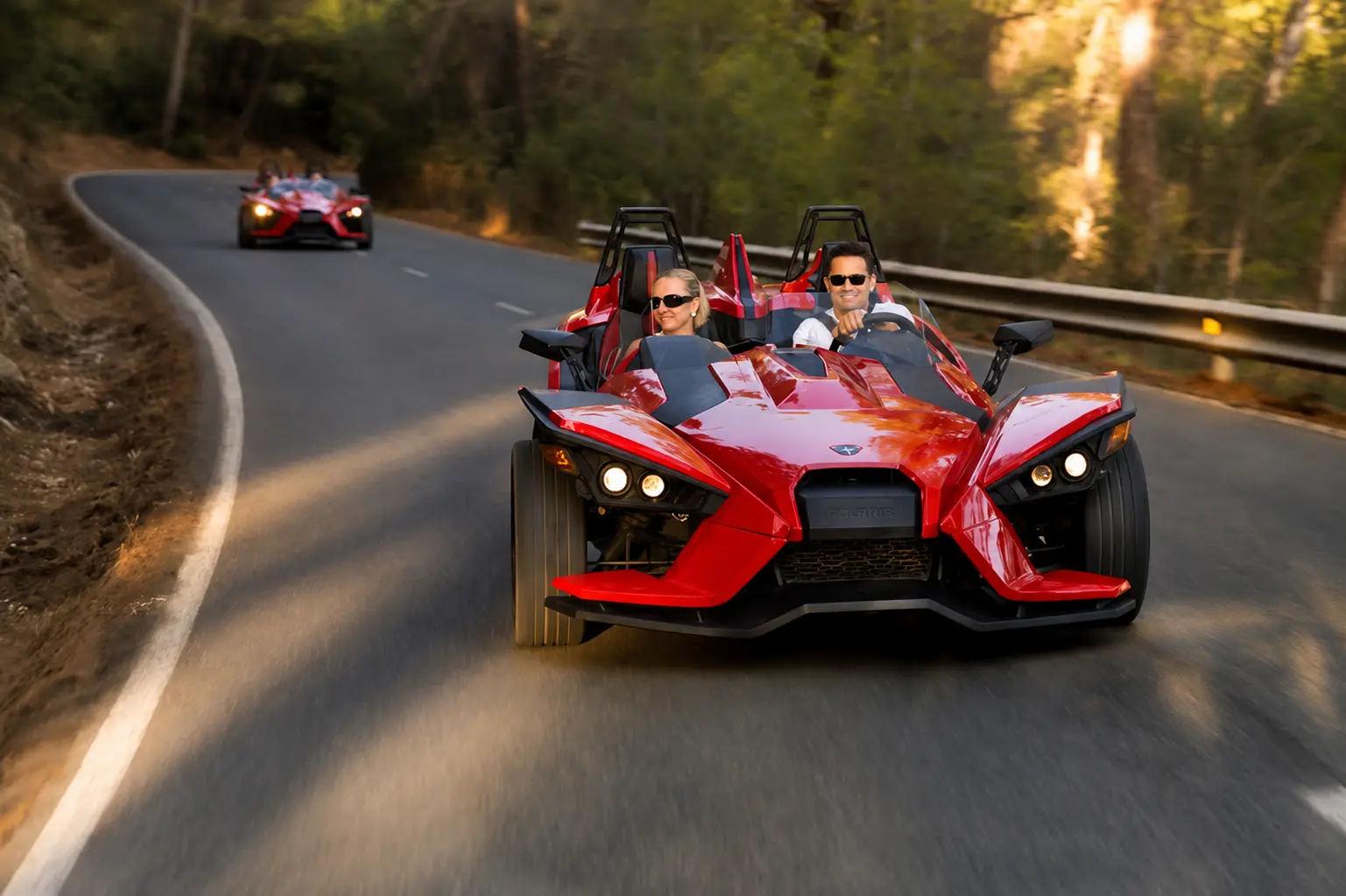 Three-wheeled Formula-style car on a coastal road in the Serra de Tramuntana, Mallorca