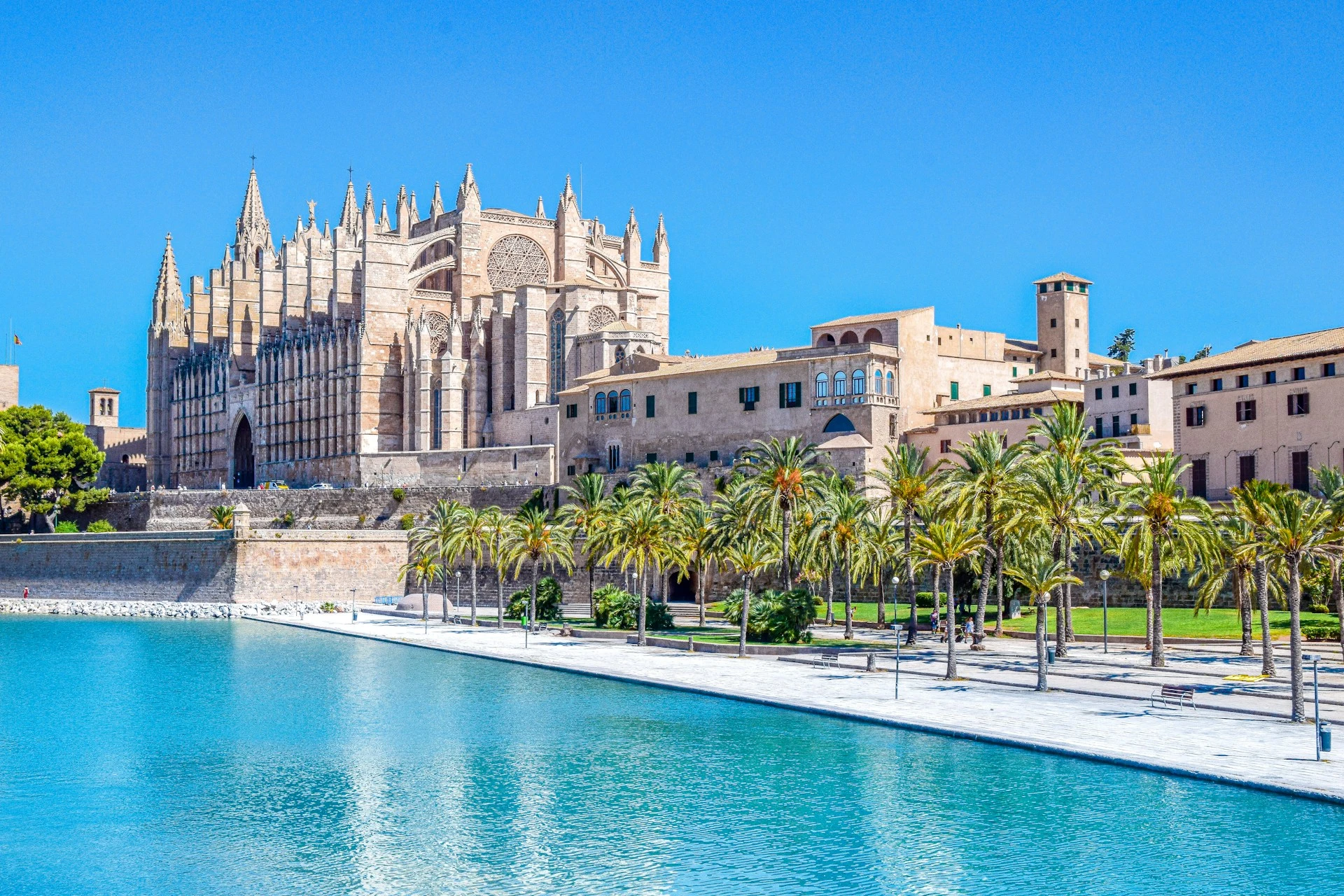 La Seu, the Gothic Cathedral of Palma de Mallorca, rising above the seafront and the Parc de la Mar lake