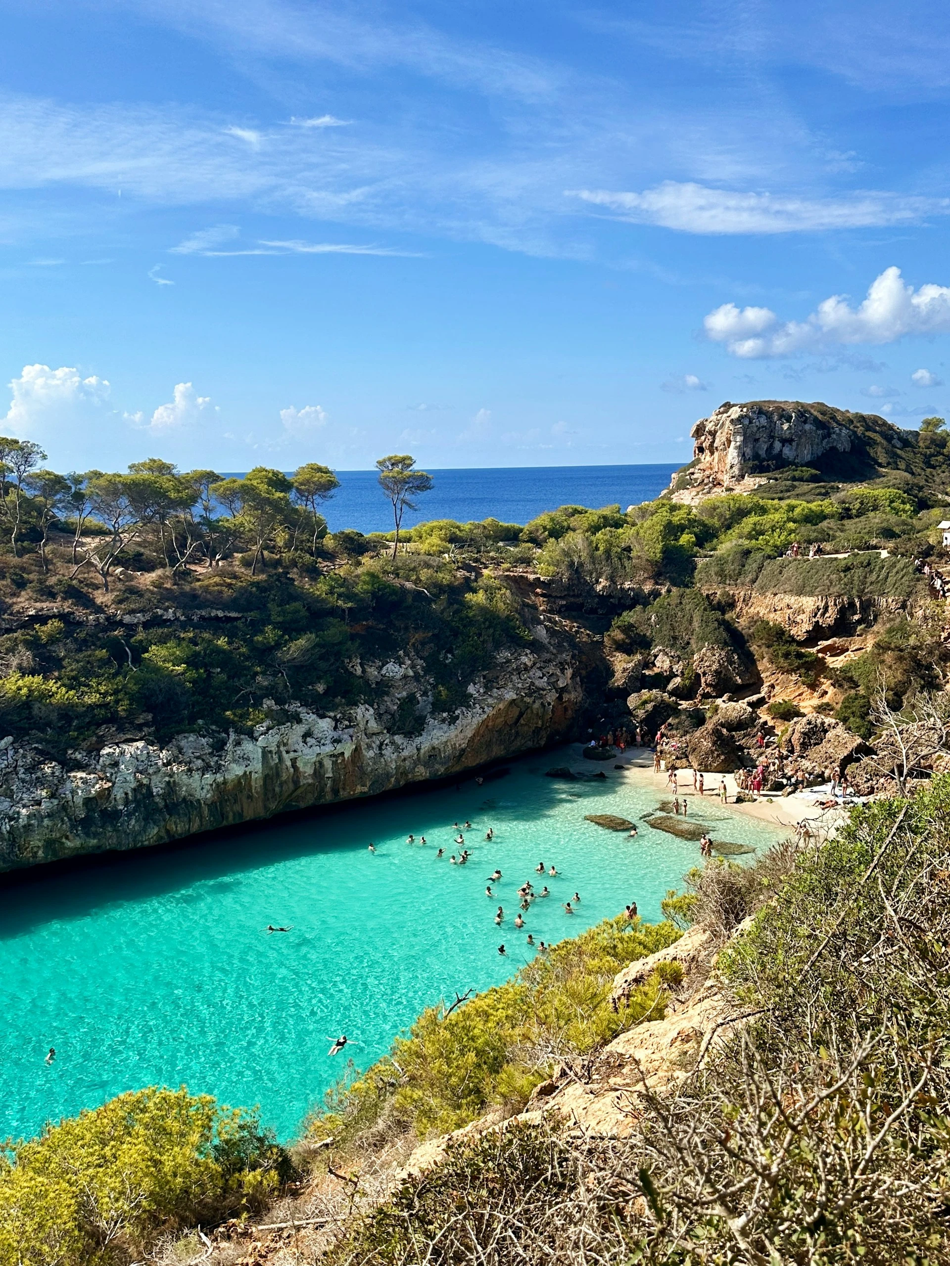 The turquoise water and steep cliffs of Es Caló des Moro, a tiny cove on the southeast coast of Mallorca