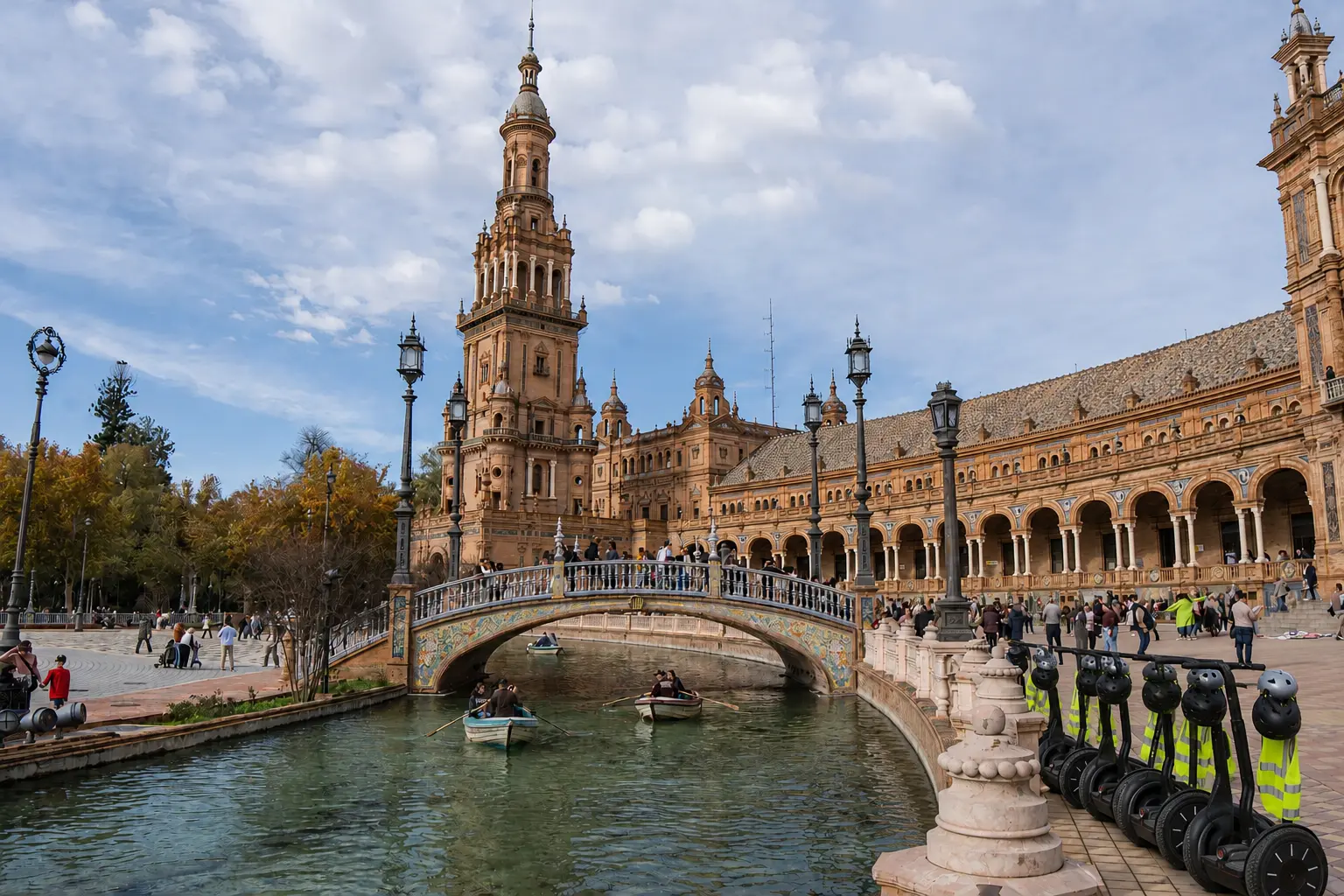 Group on a guided Segway tour passing the cathedral and Giralda in Seville, Spain